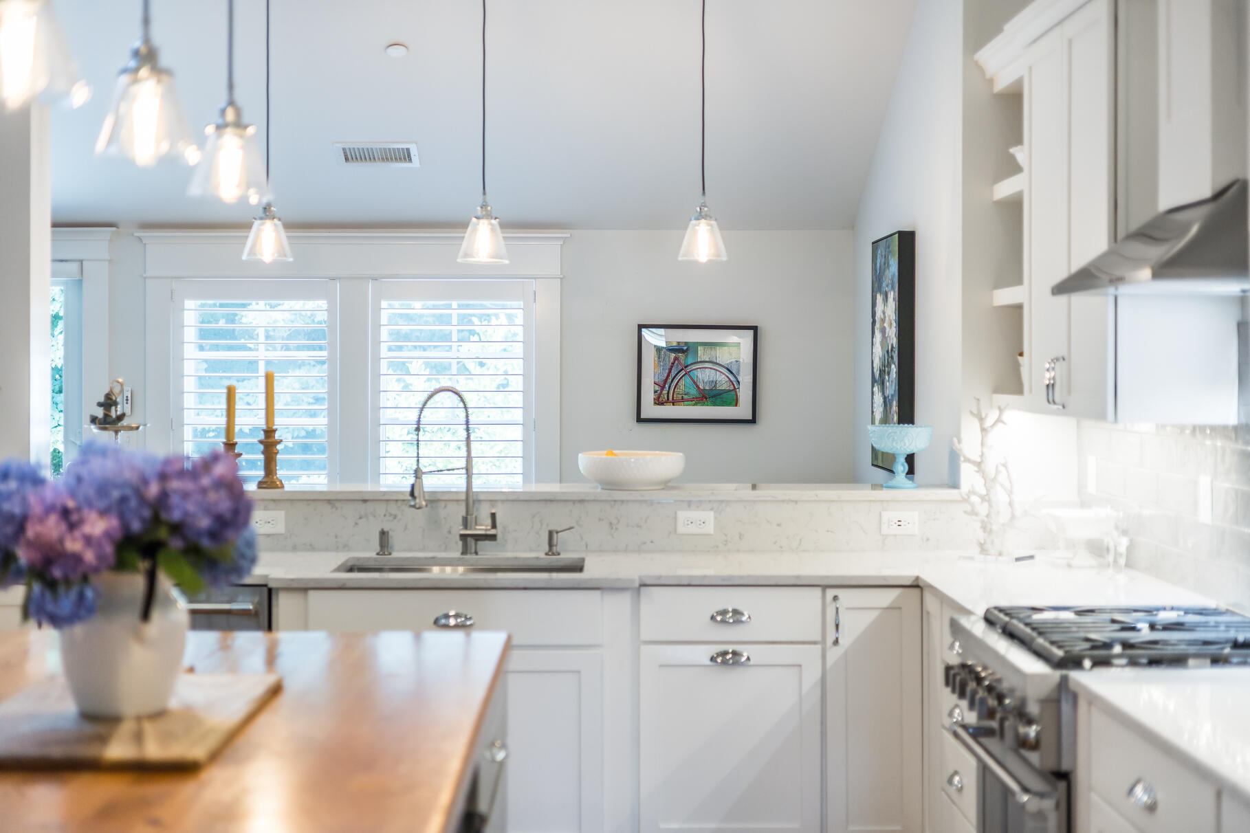 950 Massasoit Road Eastham, MA 02642 - Photo 12 of 66 a kitchen with granite countertop a sink white cabinets and a stove