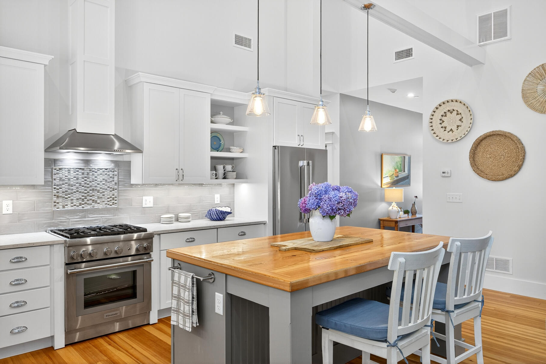 950 Massasoit Road Eastham, MA 02642 - Photo 15 of 66 a kitchen with a table and stove