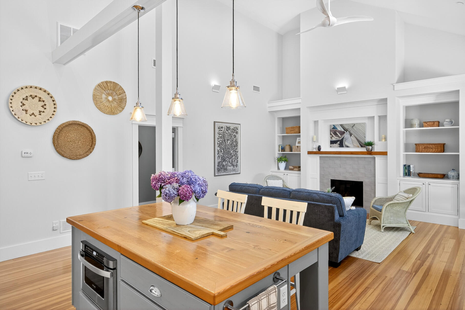 950 Massasoit Road Eastham, MA 02642 - Photo 17 of 66 a view of a dining room with furniture wooden floor and chandelier