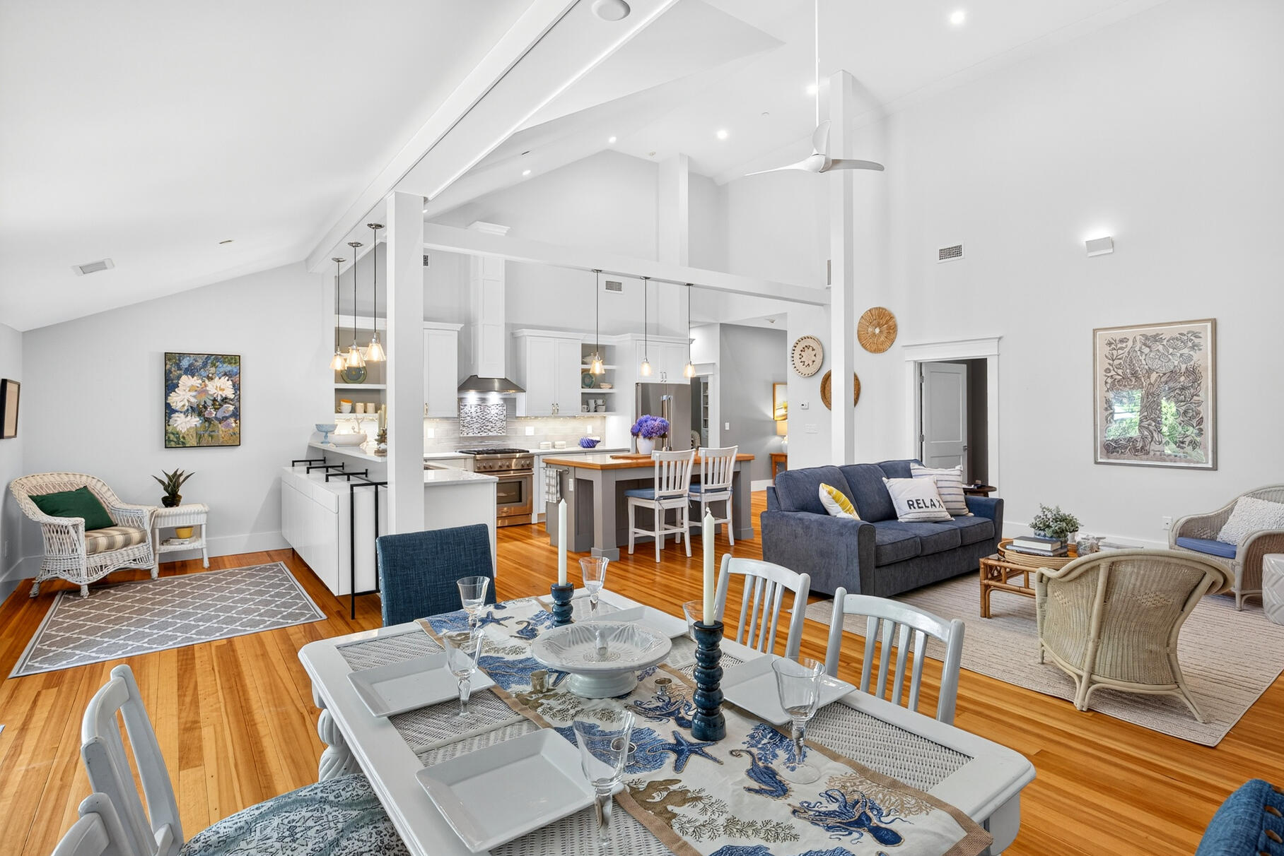 950 Massasoit Road Eastham, MA 02642 - Photo 27 of 66 a living room with furniture a rug and kitchen view