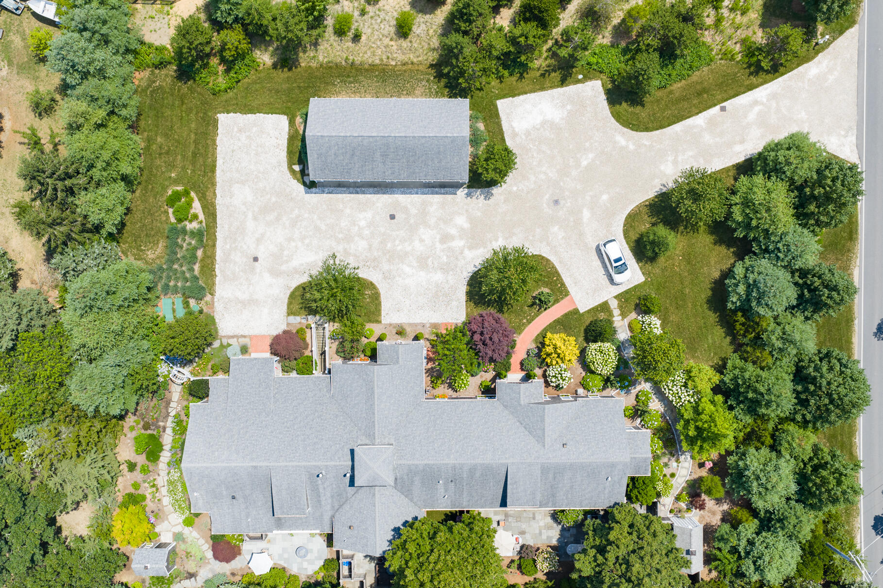 950 Massasoit Road Eastham, MA 02642 - Photo 3 of 66 an aerial view of a house with a yard and a garden
