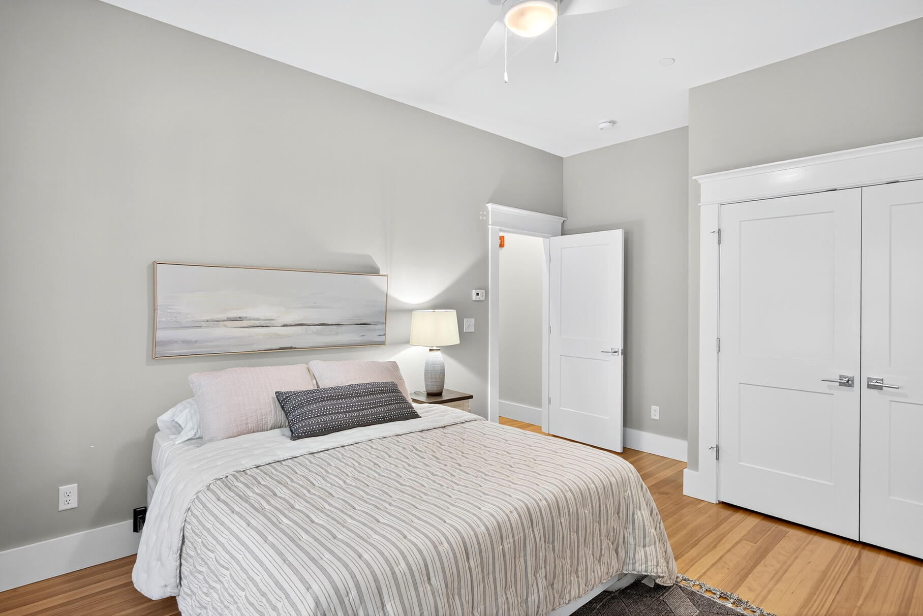 950 Massasoit Road Eastham, MA 02642 - Photo 49 of 66 a bedroom with a bed and wooden floor