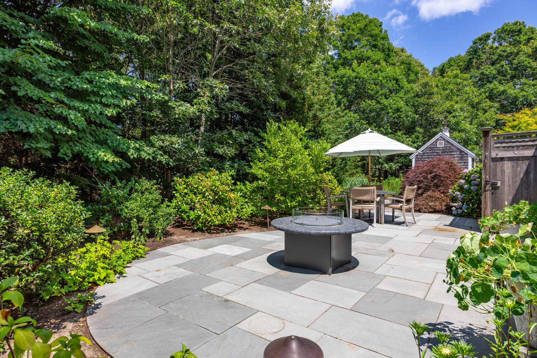 950 Massasoit Road Eastham, MA 02642 - Photo 59 of 66 a view of a backyard with garden and sitting area