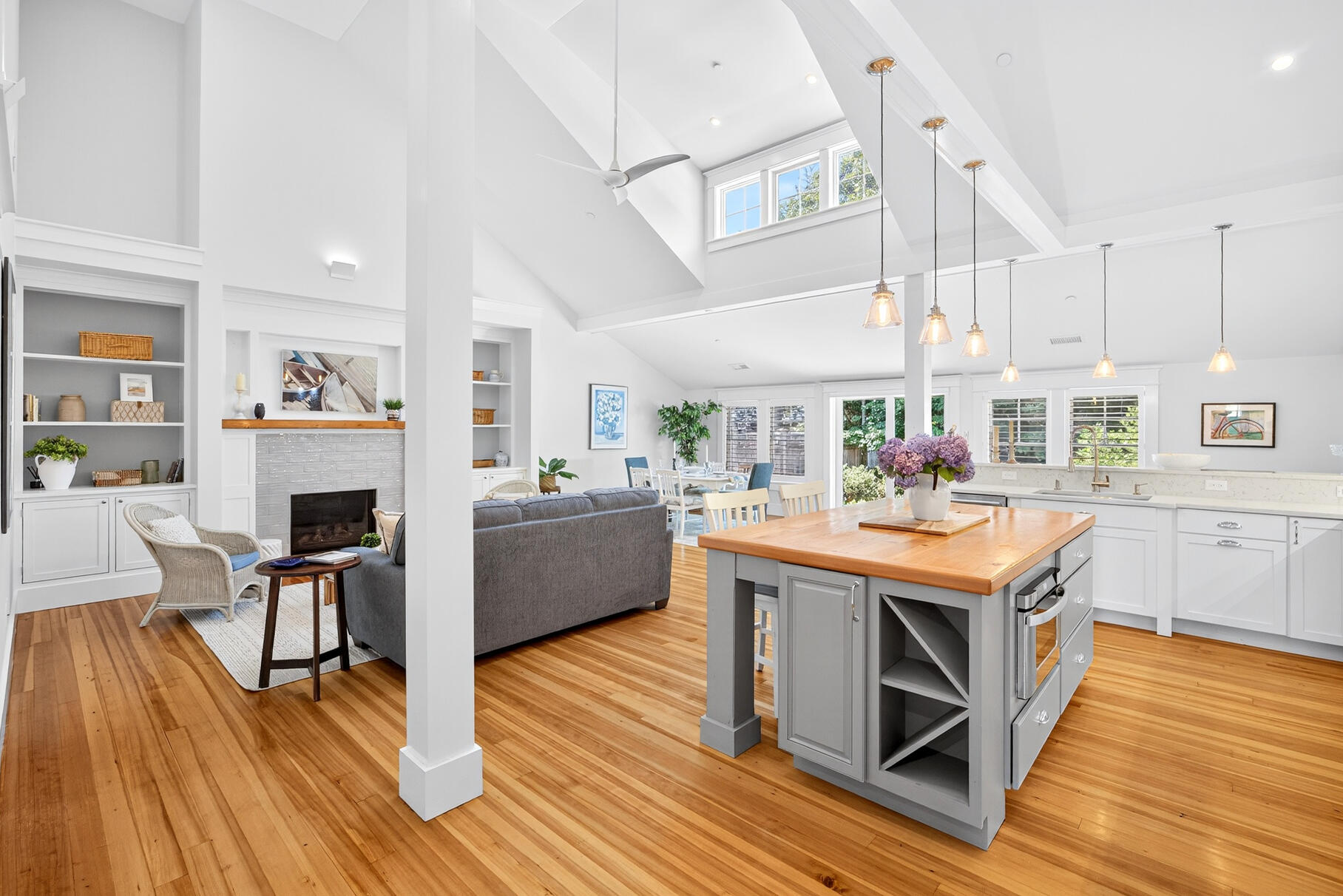 950 Massasoit Road Eastham, MA 02642 - Photo 10 of 66 a living room with furniture a fireplace and wooden floor