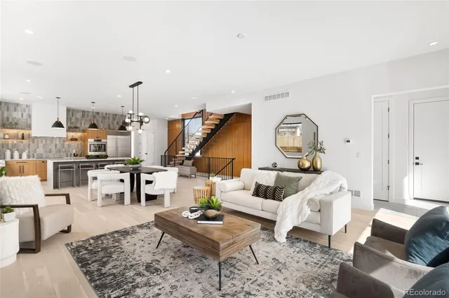 a living room with furniture and a rug