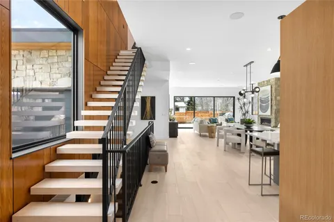 a kitchen with kitchen island granite countertop a stove and a sink