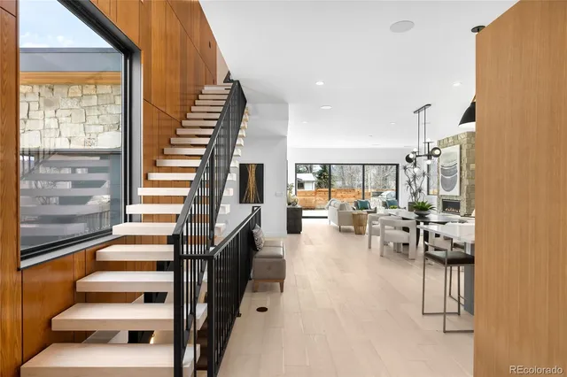 a view of entryway and hall with wooden floor
