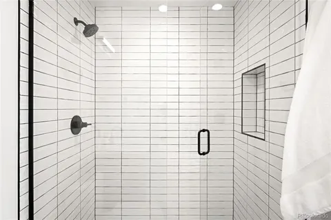 a front view of a building with large trees