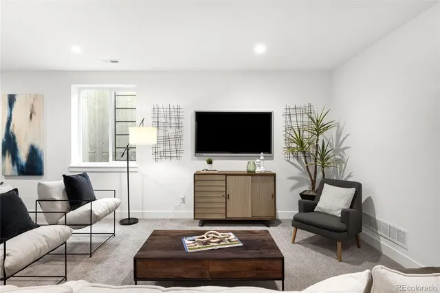 a view of a dining room with furniture and window