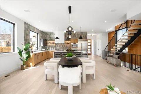 a living room with furniture a window and a chandelier