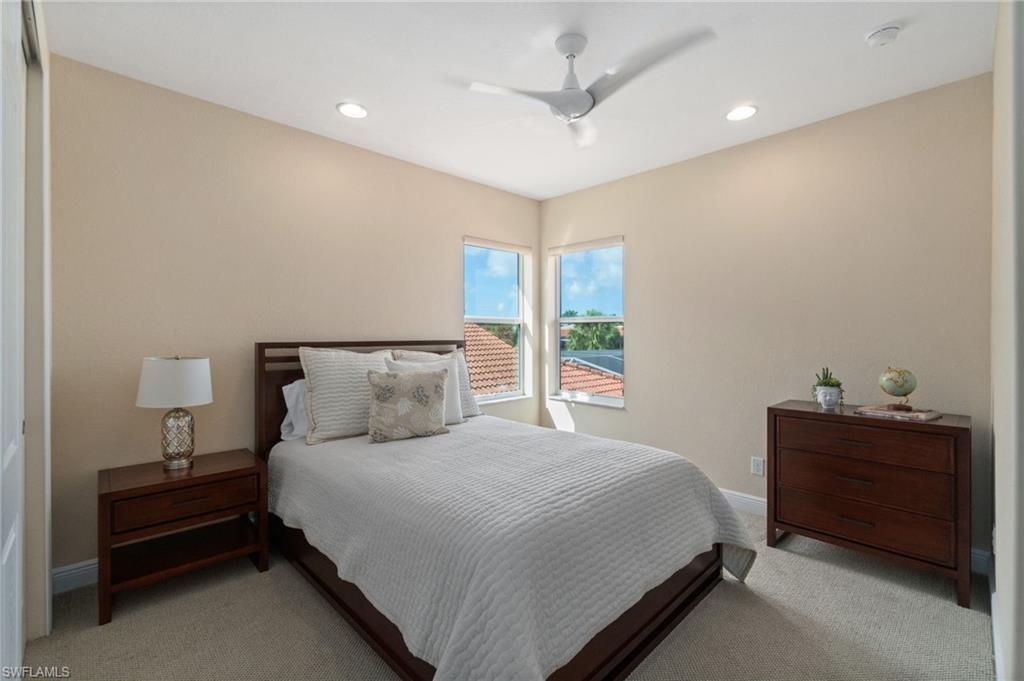 19753 Tesoro Way Estero, FL 33967 - Photo 25 of 47 a bedroom with a bed and a window
