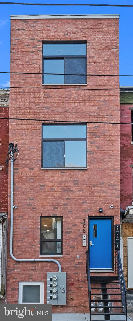 a brick building with a door and a door
