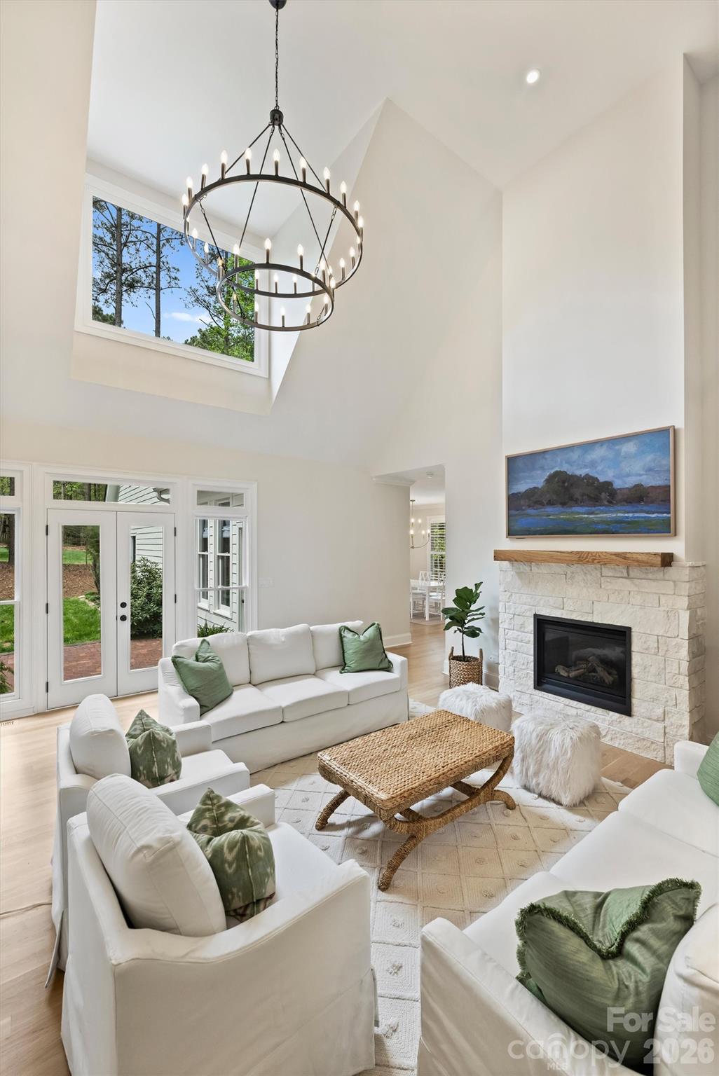 271 Beaten Path Road Mooresville, NC 28117 - Photo 12 of 47 a living room with furniture a chandelier and a fireplace