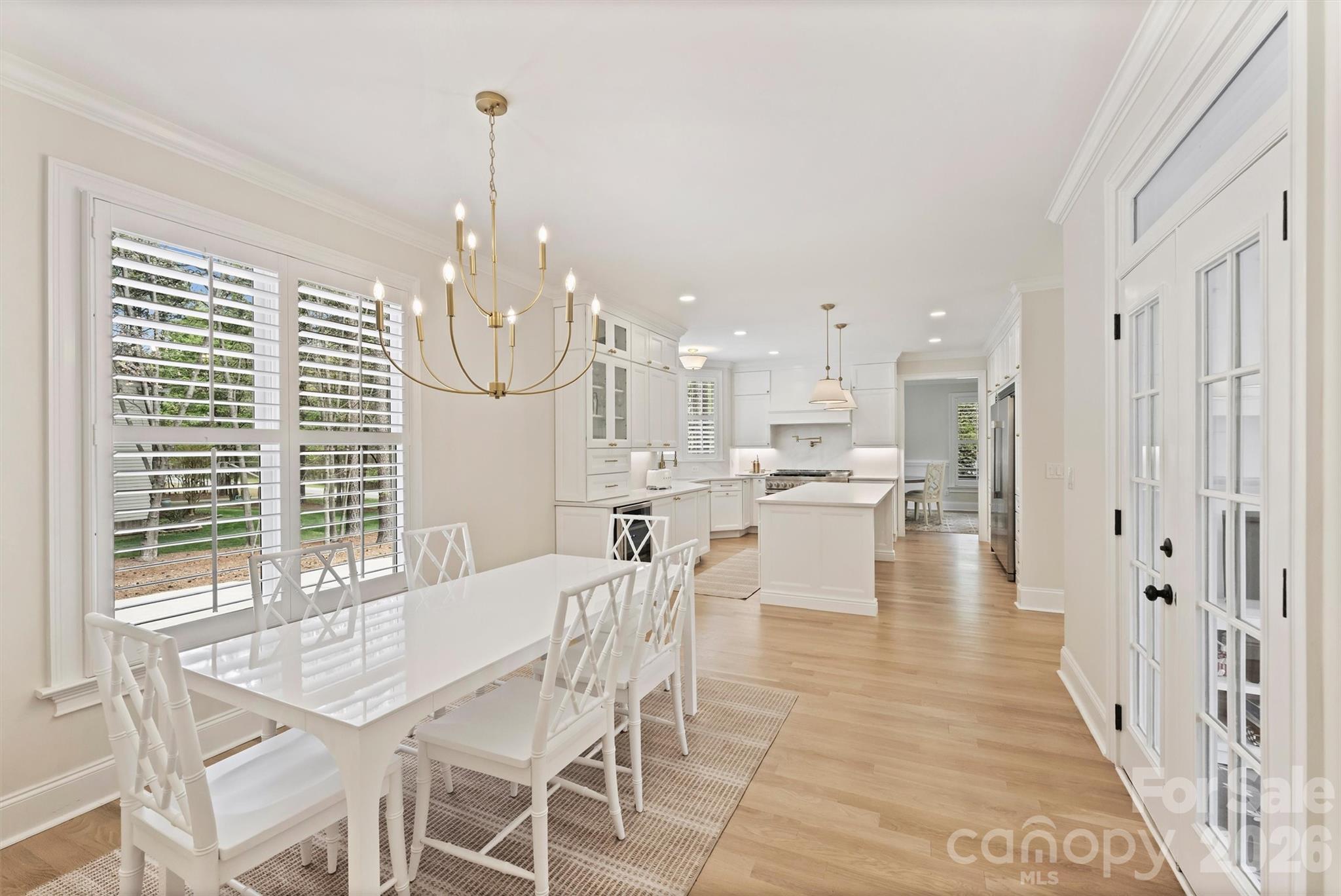 271 Beaten Path Road Mooresville, NC 28117 - Photo 17 of 47 a dining room with furniture a chandelier and kitchen view