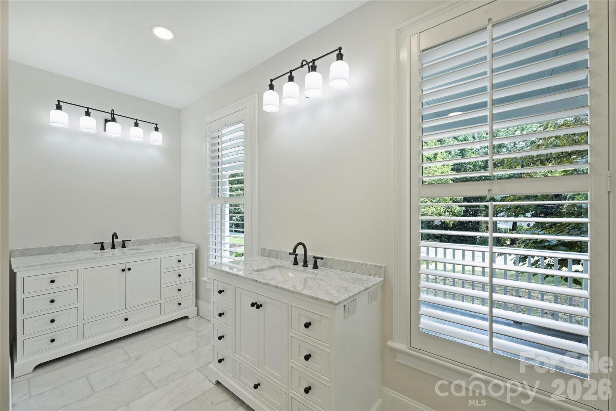 271 Beaten Path Road Mooresville, NC 28117 - Photo 26 of 47 a bathroom with a double vanity sink a mirror and a bathtub