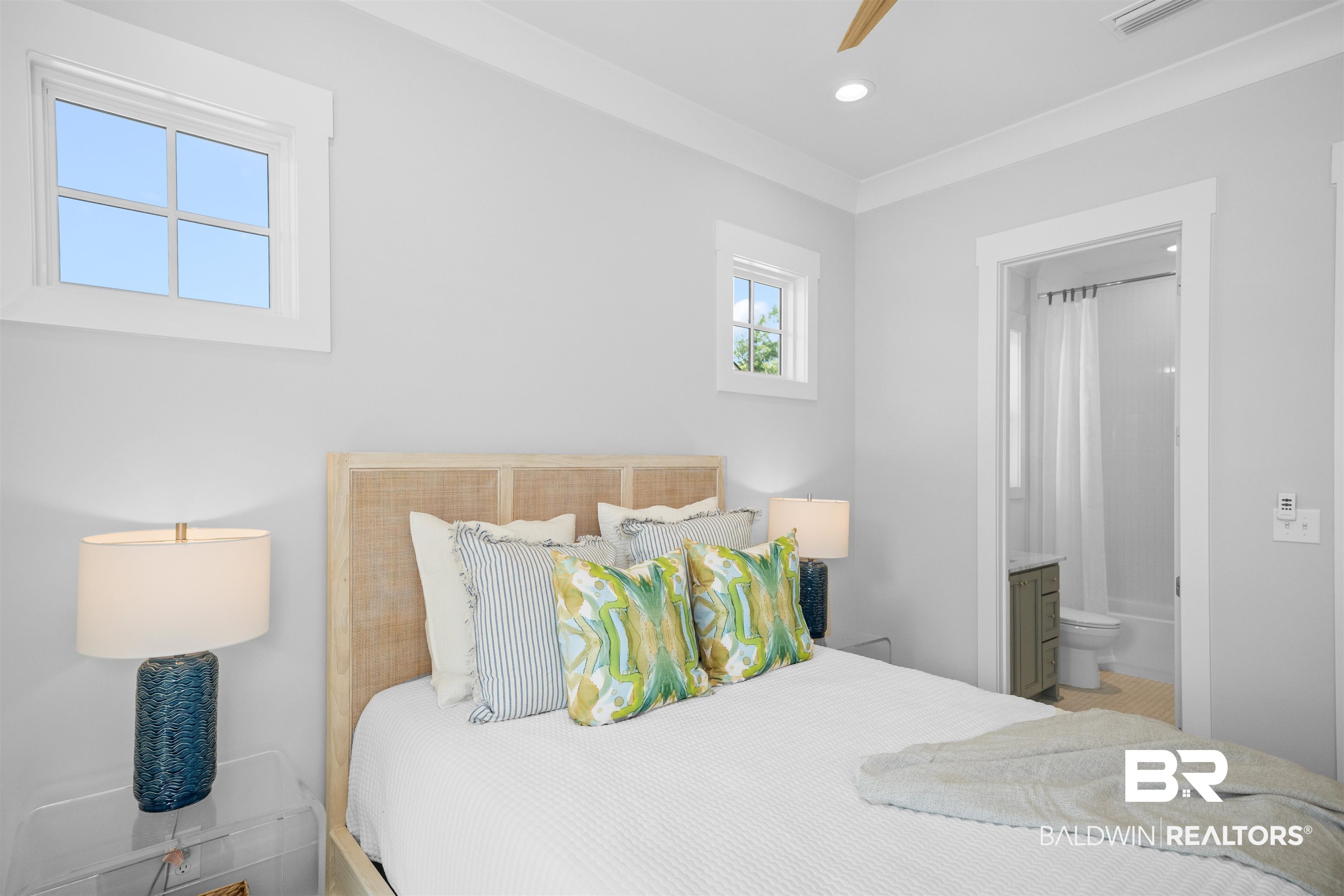 156 Hyacinth Street Fairhope, AL 36532 - Photo 52 of 61 Bedroom featuring connected bathroom and a ceiling fan