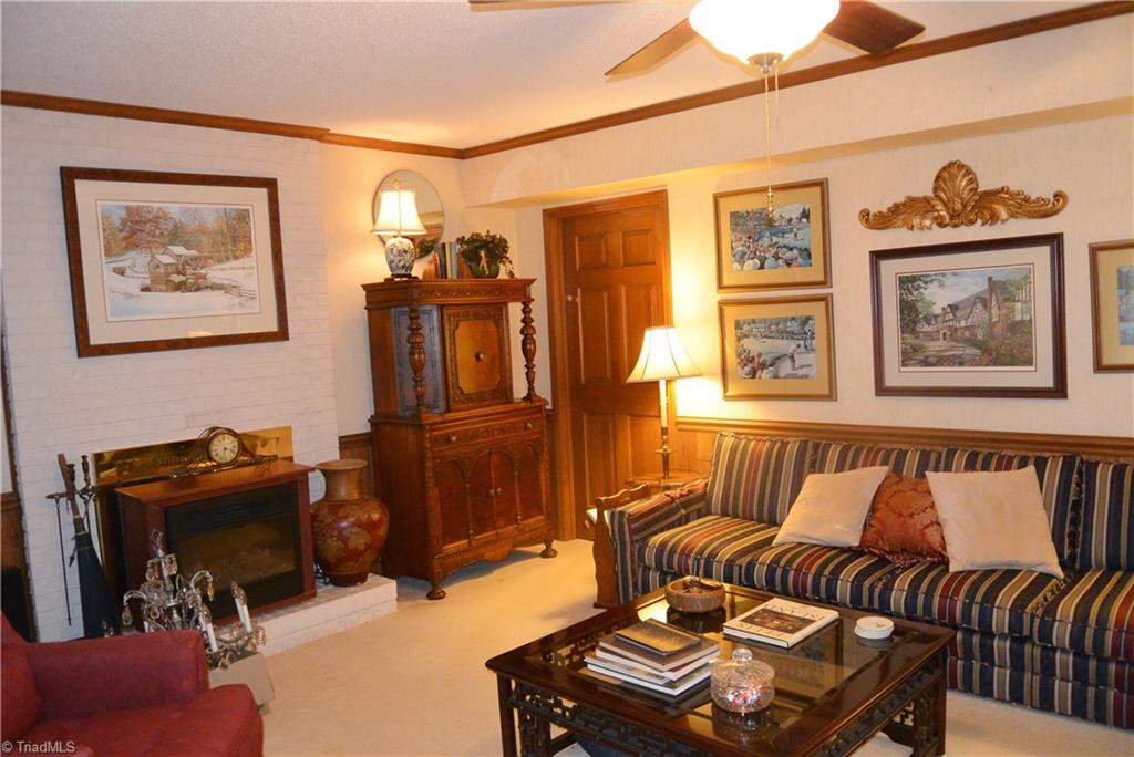 552 Lindley Road Greensboro, NC 27410 - Photo 17 of 30 Lower level den is very spacious and has gas log fireplace