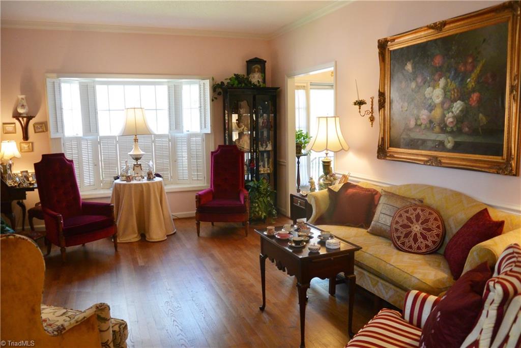 Wood floors in living room and dining room. Bay window and wood burning fireplace complete this formal room.