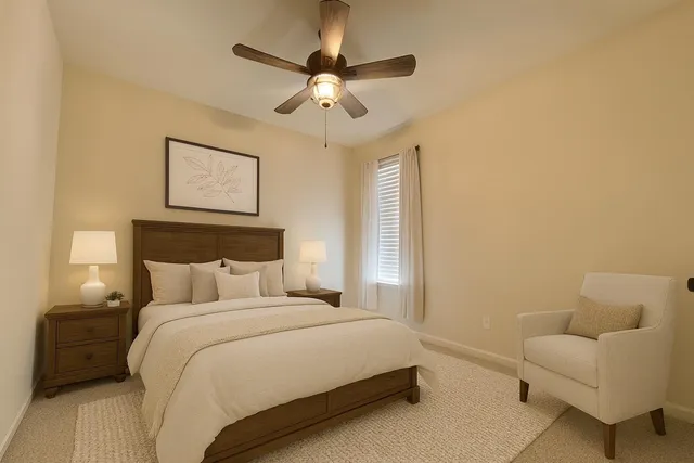 a bedroom with bed and a couch