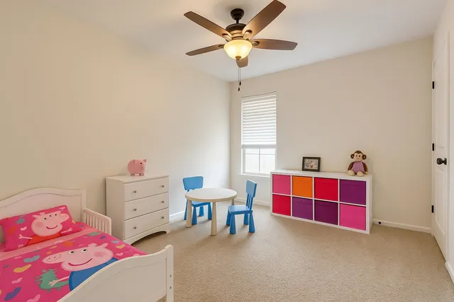 a bedroom with furniture and a window