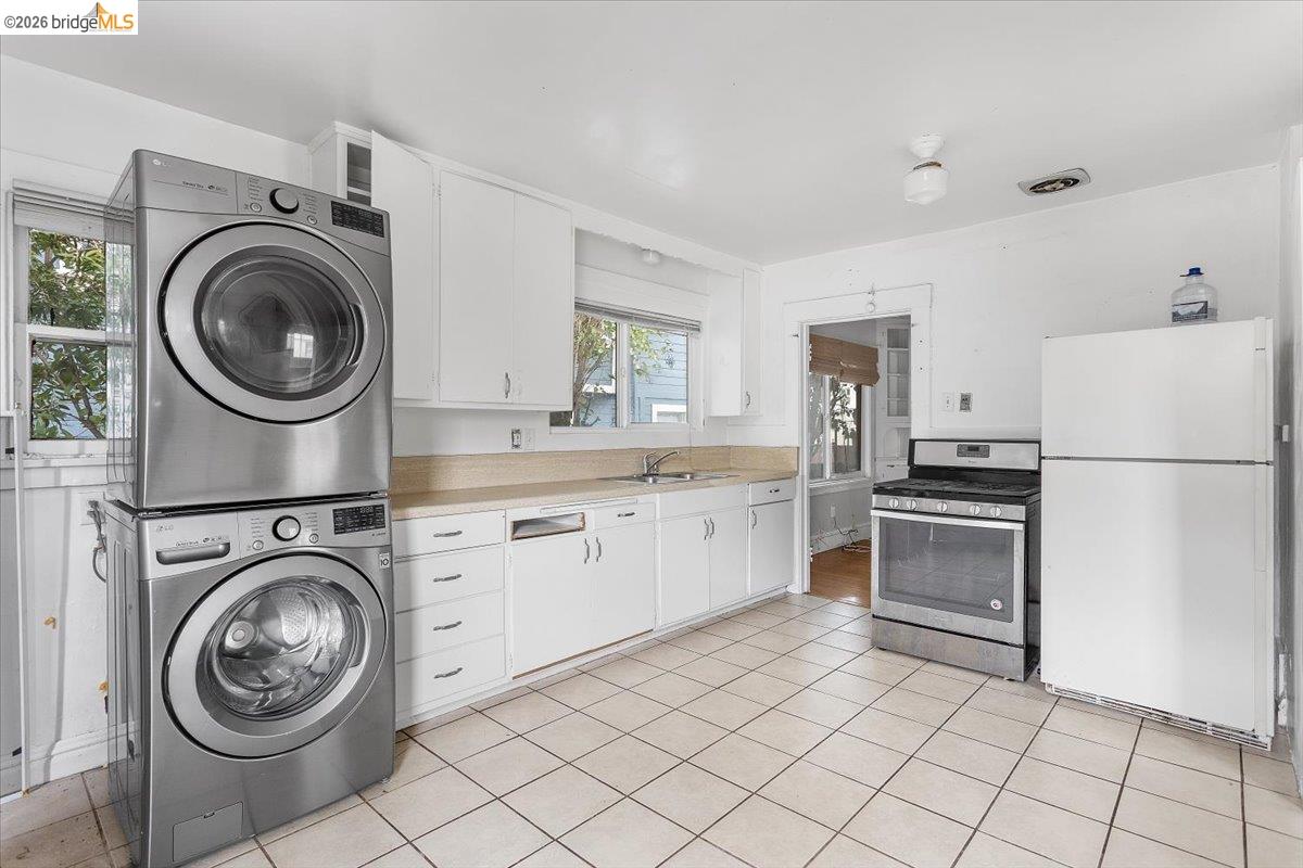 3029 Chestnut Street Oakland, CA 94608 - Photo 16 of 23 a kitchen with a stove top oven sink and cabinets