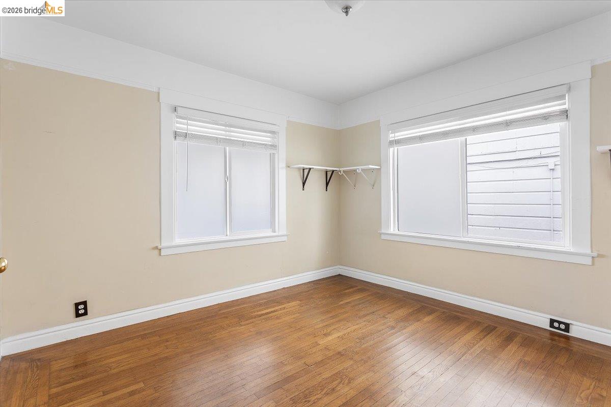 3029 Chestnut Street Oakland, CA 94608 - Photo 18 of 23 a big room with wooden floor and windows