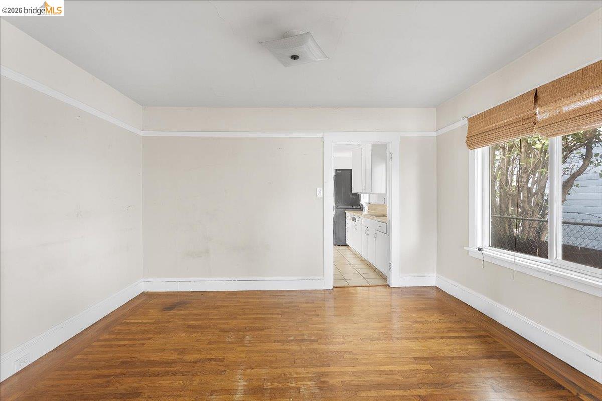 3029 Chestnut Street Oakland, CA 94608 - Photo 19 of 23 a view of empty room with wooden floor and fan
