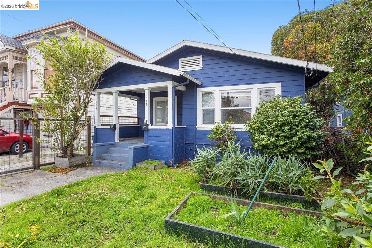 3029 Chestnut Street Oakland, CA 94608 - Photo 5 of 23 a view of a house with a yard