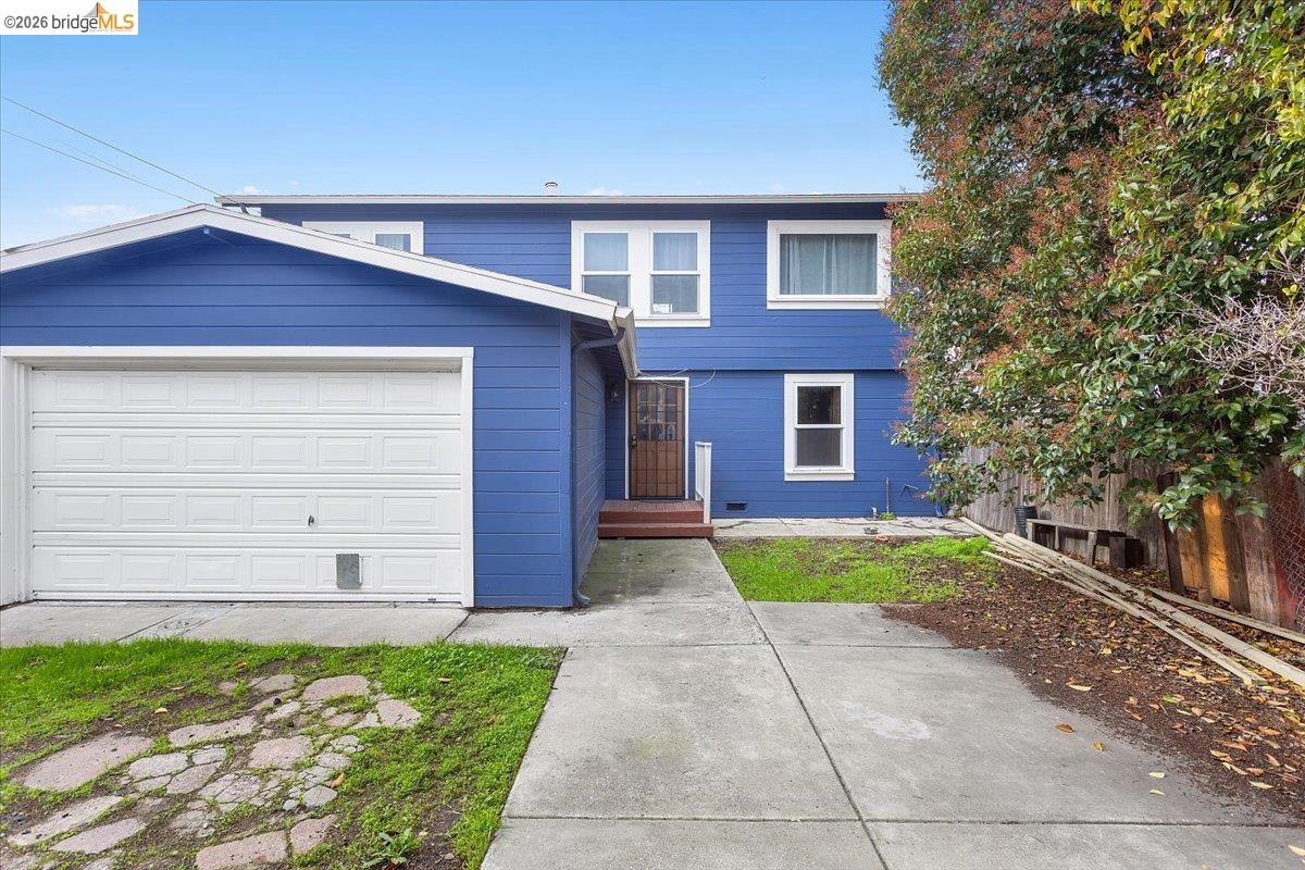 3029 Chestnut Street Oakland, CA 94608 - Photo 8 of 23 a front view of a house with a yard