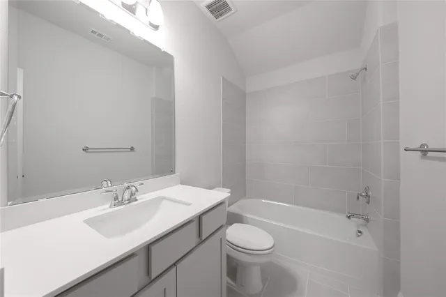 a bathroom with a sink a toilet and bathtub