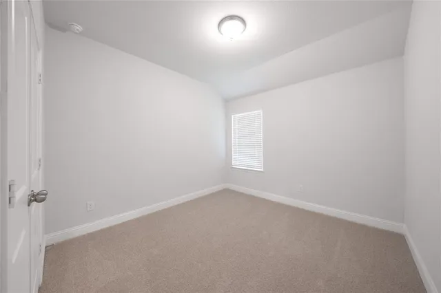 an empty room with a empty space and window