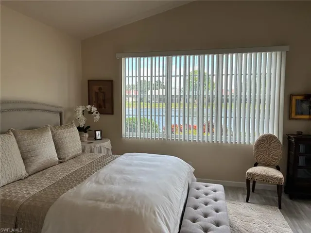 a view of a balcony with chairs and wooden floor