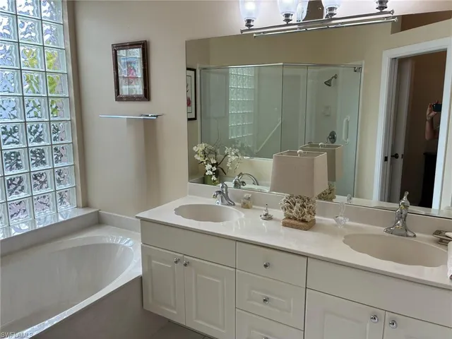 a view of a balcony with floor to ceiling windows