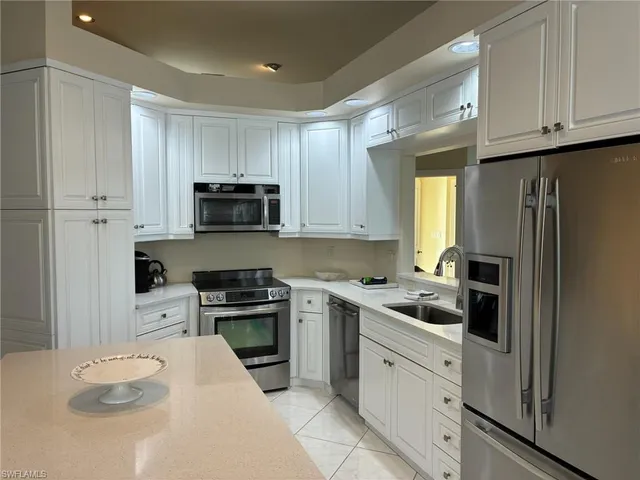 a view of a livingroom with furniture and flat screen tv