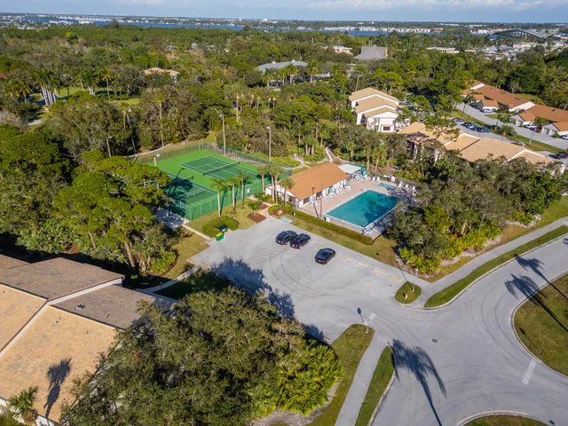 an aerial view of residential houses with outdoor space