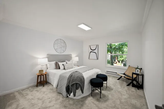 a bedroom with a bed and a table in it