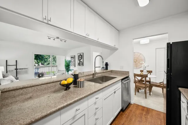 a kitchen with sink and cabinets