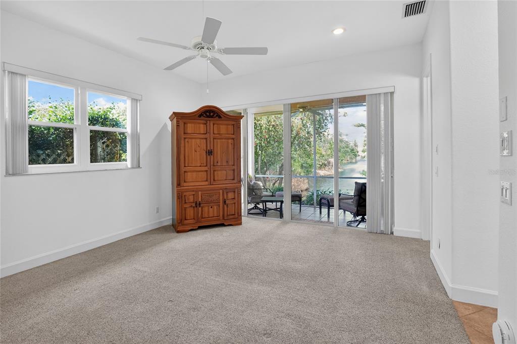 2968 Plantation Road Winter Haven, FL 33884 - Photo 28 of 81 a view of an empty room with furniture and a large window