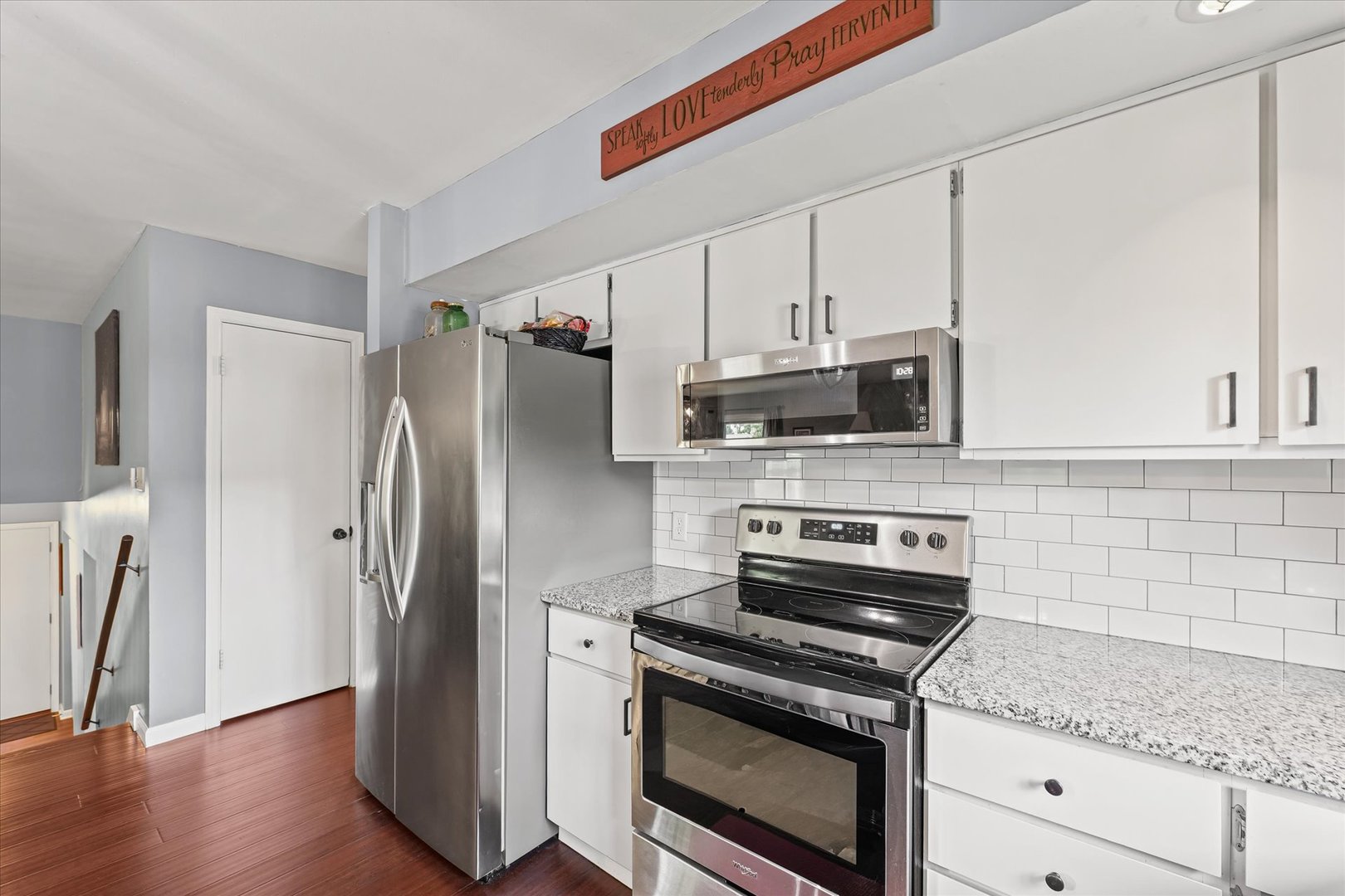1011 Harrington Drive Champaign, IL 61821 - Photo 13 of 37 a kitchen with stainless steel appliances granite countertop a refrigerator microwave and stove