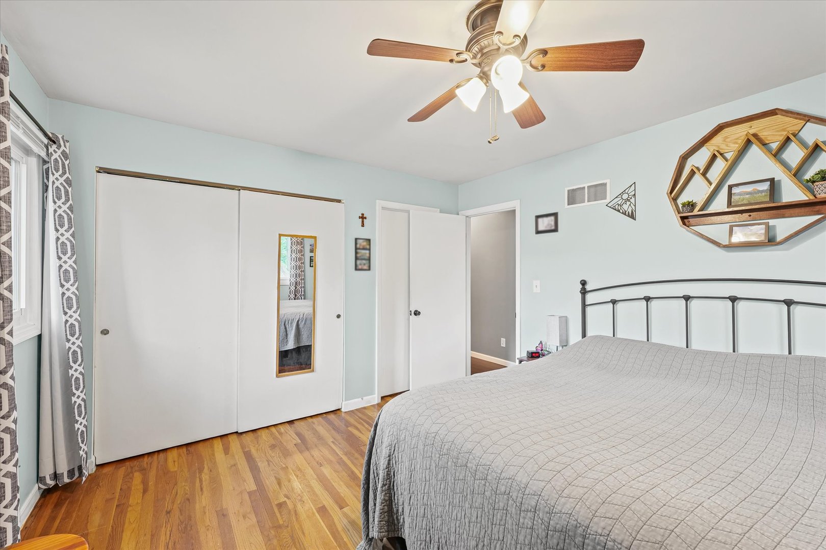 1011 Harrington Drive Champaign, IL 61821 - Photo 16 of 37 a bedroom with a large bed and a chandelier