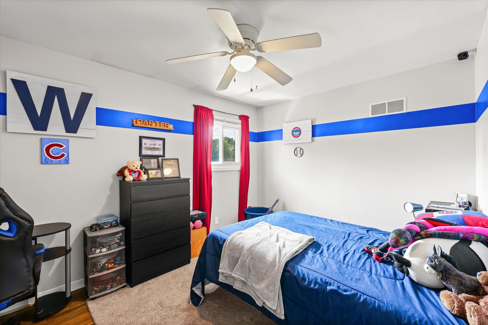 1011 Harrington Drive Champaign, IL 61821 - Photo 19 of 37 a bedroom with a bed and a chandelier