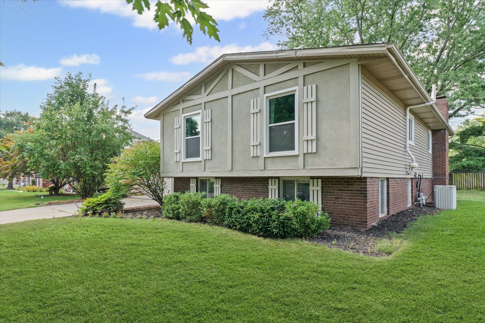 1011 Harrington Drive Champaign, IL 61821 - Photo 2 of 37 a front view of house with garden