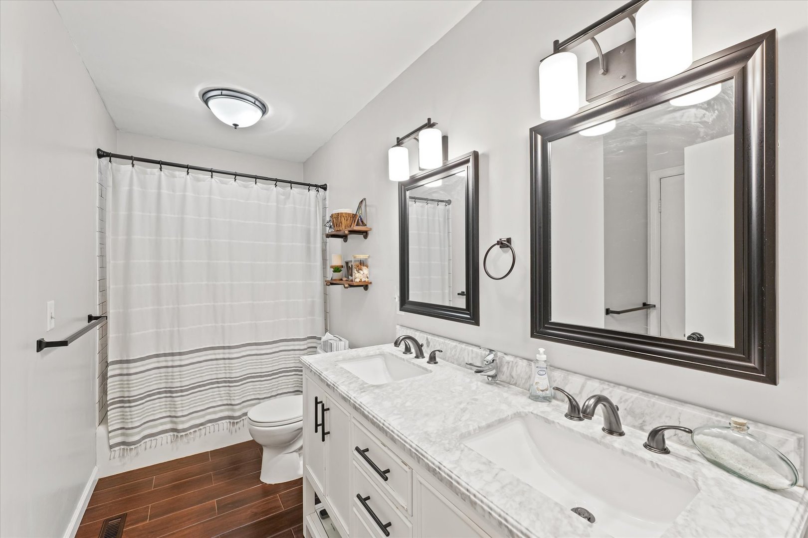 1011 Harrington Drive Champaign, IL 61821 - Photo 21 of 37 a bathroom with a sink and a mirror