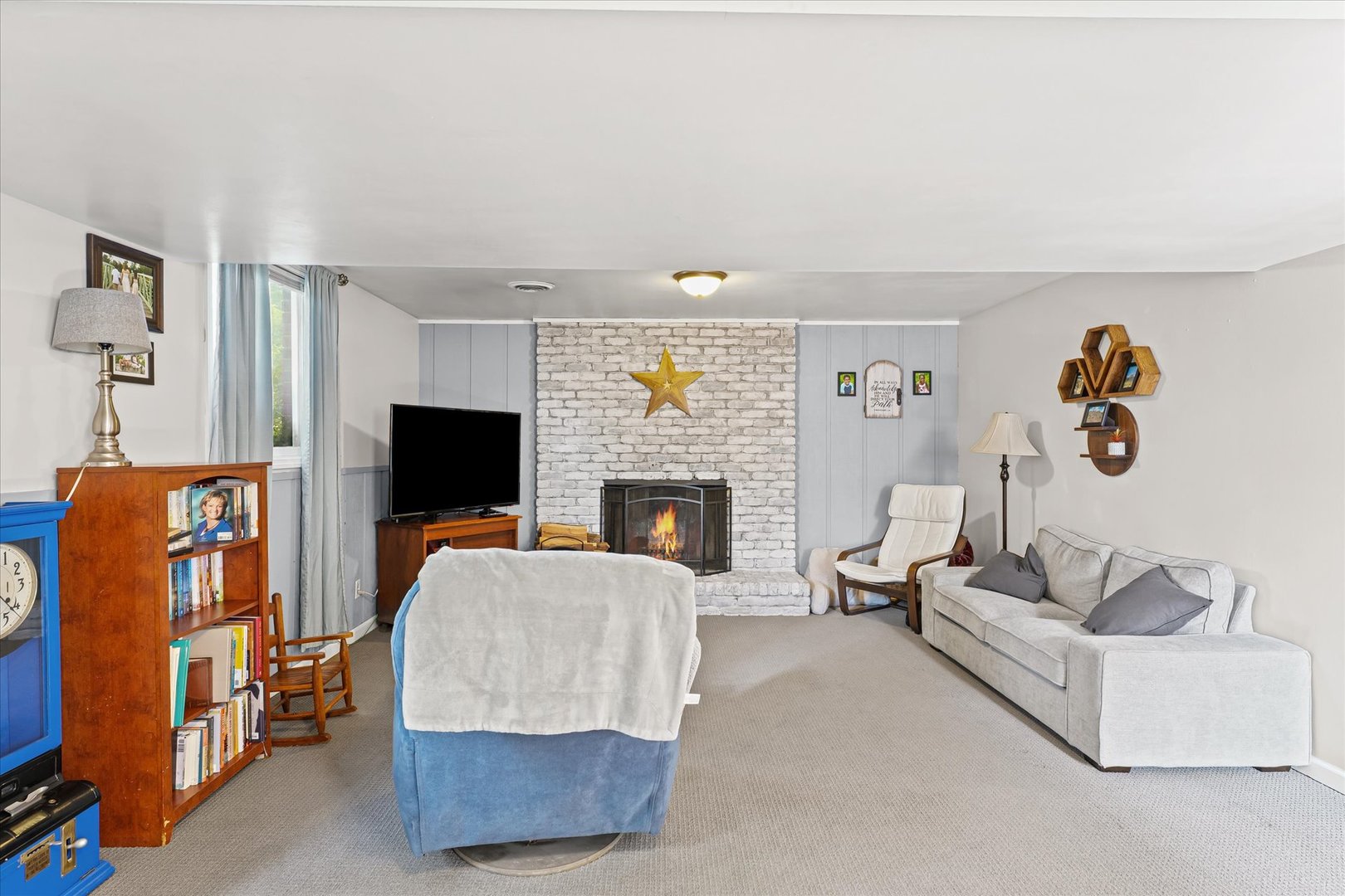 1011 Harrington Drive Champaign, IL 61821 - Photo 26 of 37 a living room with furniture and a flat screen tv