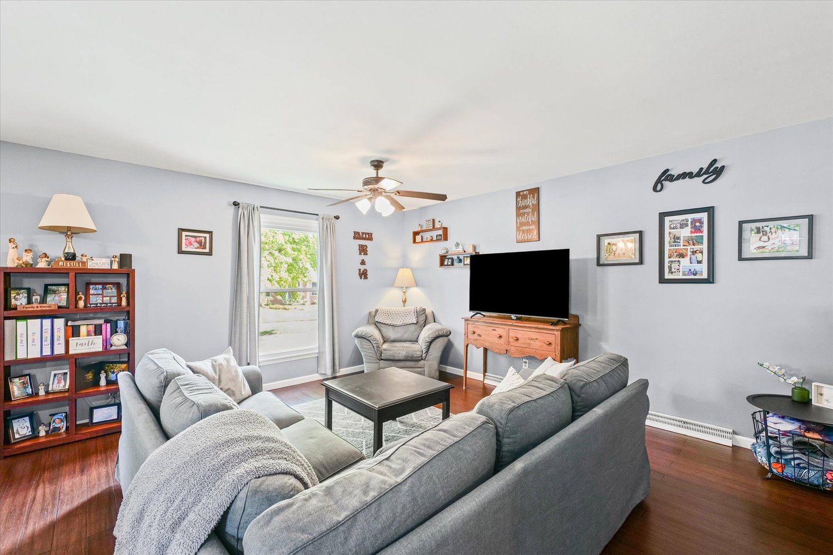 1011 Harrington Drive Champaign, IL 61821 - Photo 3 of 37 a living room with furniture and a flat screen tv