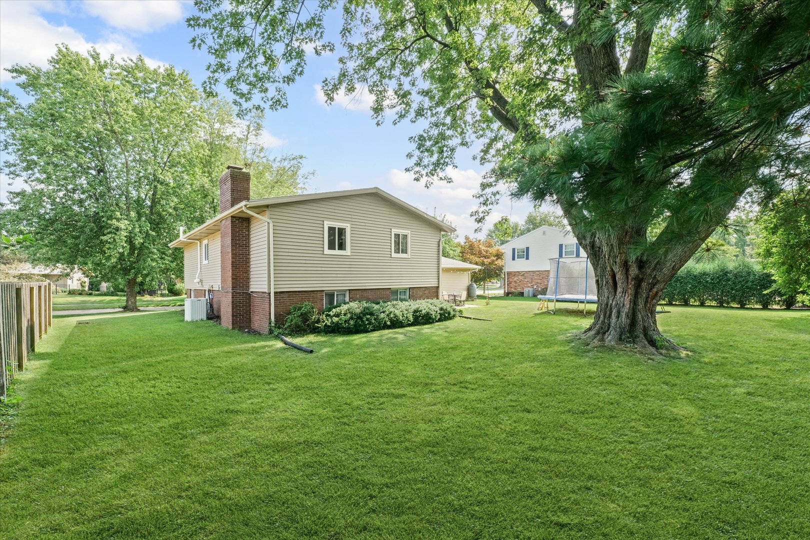 1011 Harrington Drive Champaign, IL 61821 - Photo 35 of 37 a front view of house with yard and green space