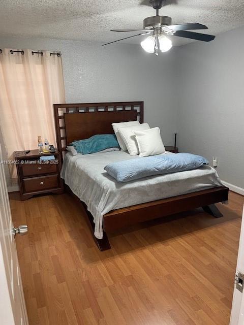 8340 Northwest 8th Street, Unit N12 Miami, FL 33126 - Photo 12 of 21 a bedroom with a bed window and a couch