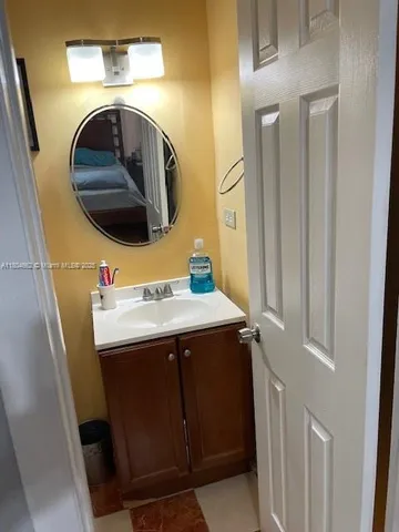 a utility room with a sink and washer