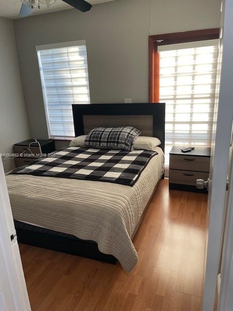 8340 Northwest 8th Street, Unit N12 Miami, FL 33126 - Photo 19 of 21 a bedroom with a bed and a window