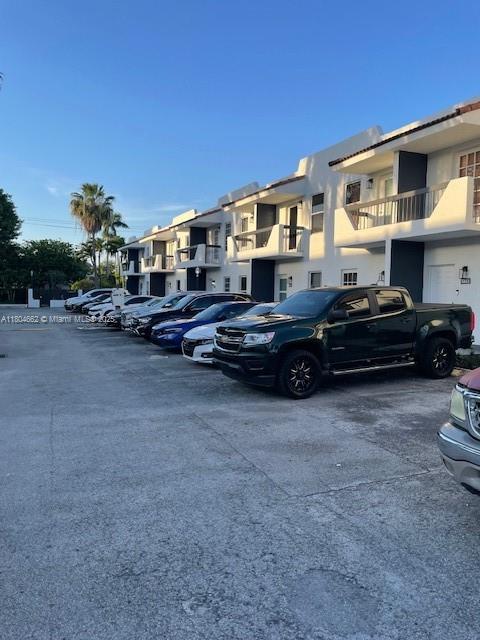 8340 Northwest 8th Street, Unit N12 Miami, FL 33126 - Photo 20 of 21 a car parked in front of a house